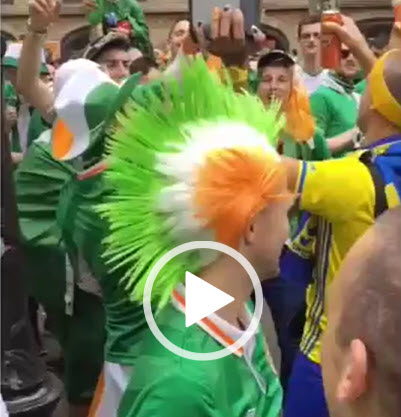 Irish fans dance with Swedish fans